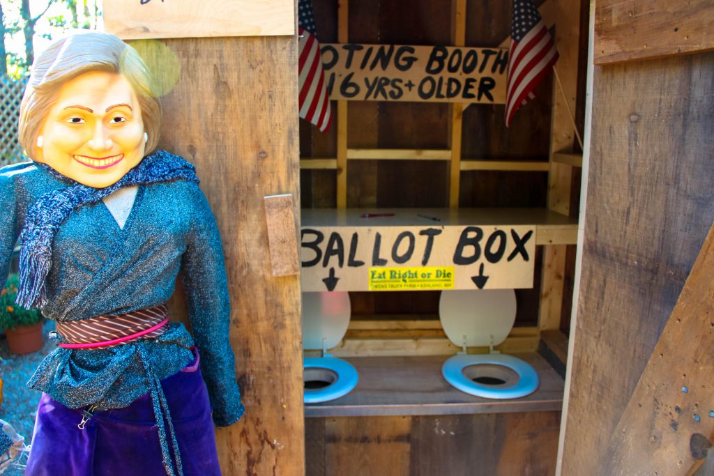 The rare "two-seater" outhouse with a mannequin representing Hillary Clinton. (Credit: Sean Hurley/ NHPR)