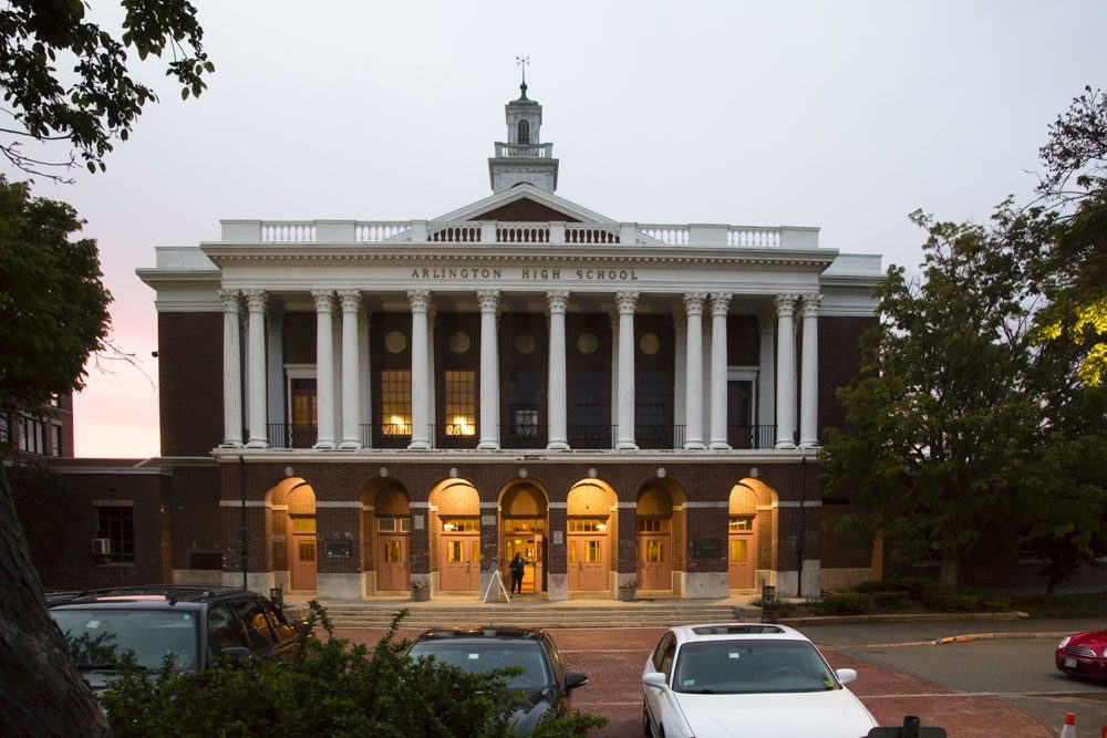After graffiti with anti-gay and anti-Semitic messages were found at Arlington High School, students wrote messages of inclusion in chalk on the building's front brick archways. Photo by Jess Voas for WBUR