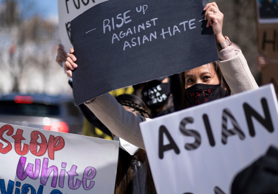 Massage-Business-Shootings Mai Wright holds a sign while participating in a "Stop Asian Hate" rally outside the Georgia State Capitol in Atlanta on March 20, 2021. (Ben Gray/AP Photo)